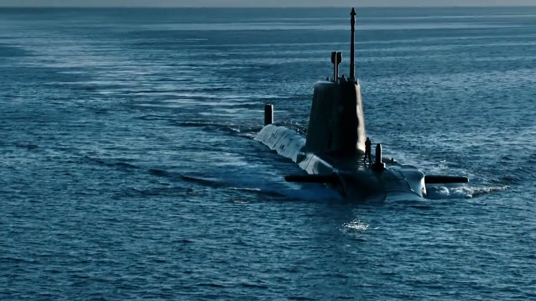 Royal Navy submarine sailing on the surface of the sea