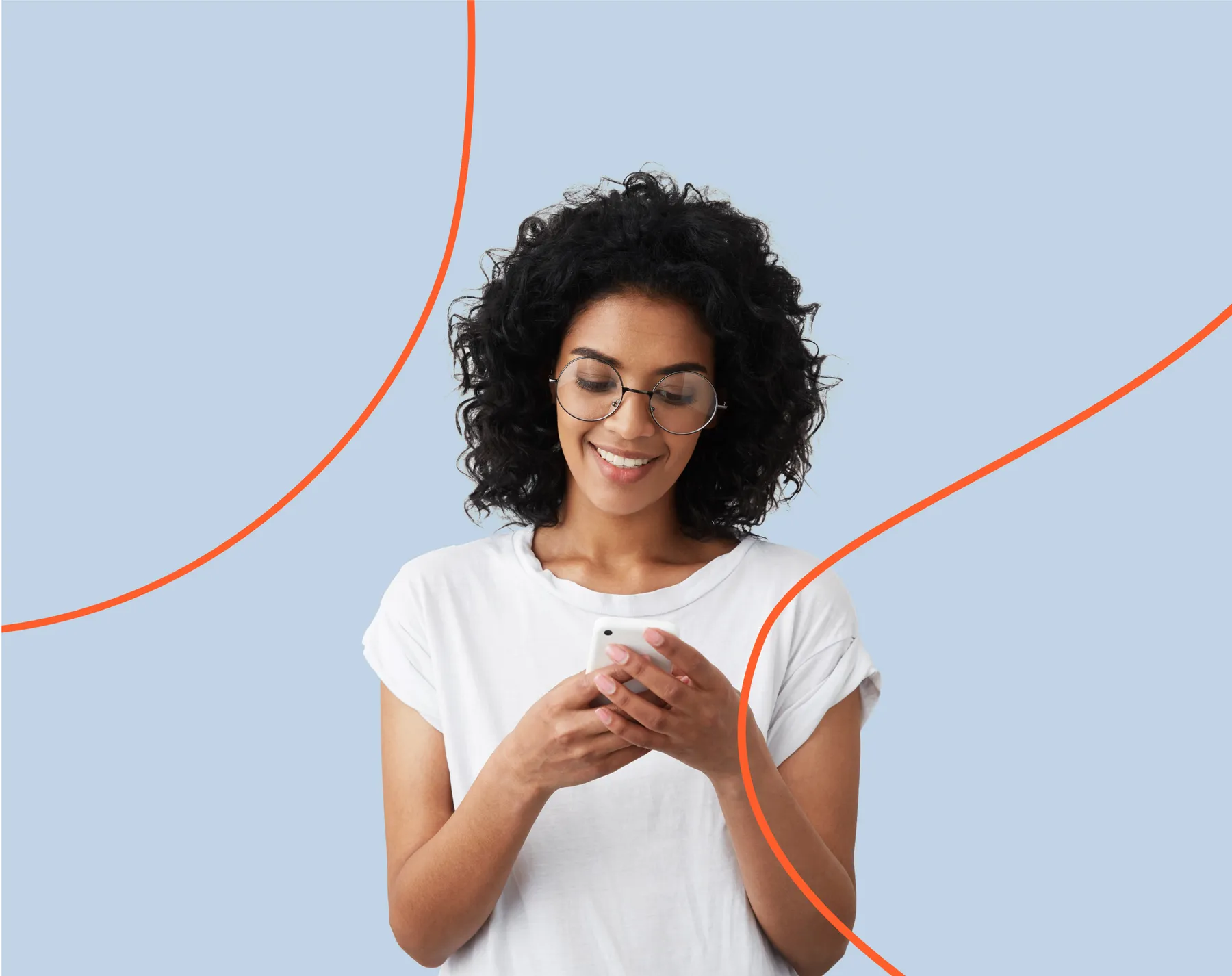 Smiling woman in glasses chatting on her smartphone